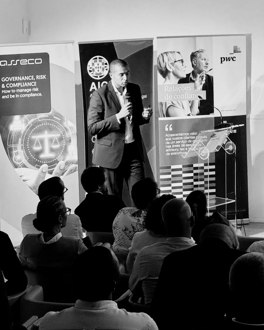 Artur Poluektov speaking on stage at an AICEP event in Cape Verde